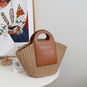 French vintage straw tote bag with brown leather patchwork and circular handles