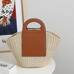 French vintage straw tote bag with brown leather patchwork and cutout handle for beach