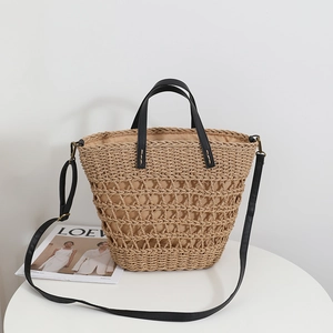 French vintage hollow straw tote bag with black leather handles and shoulder strap