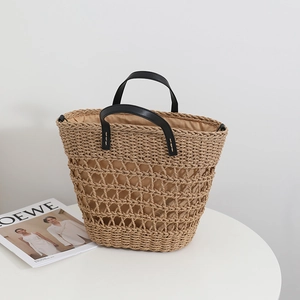 French vintage straw tote bag with hollow design and black leather straps for beach holidays