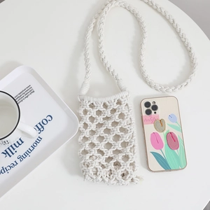 Handmade white hollow crochet phone bag with cotton cord mesh texture and crossbody strap