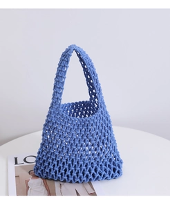 Close-up of blue cotton rope woven handbag with detailed honeycomb hollow mesh pattern