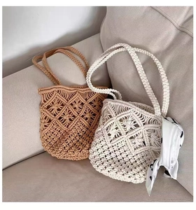 Close-up of bohemian hollow-out woven shoulder bags with decorative printed silk scarf