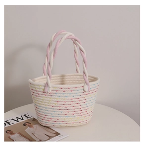 Detailed texture of handwoven tote bag with colorful stripes and braided rope handles