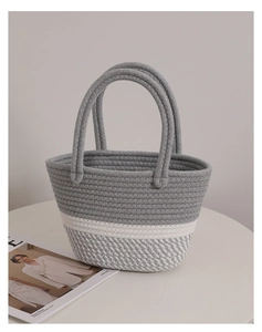 Detail of gray and white woven cotton rope tote bag showing thick handcrafted textures