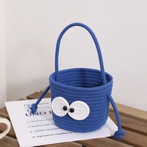 Cute blue woven cotton bucket bag with large cartoon eyes and long handles