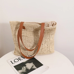 Large capacity straw tote bag with brown leather handles for summer beach vacations