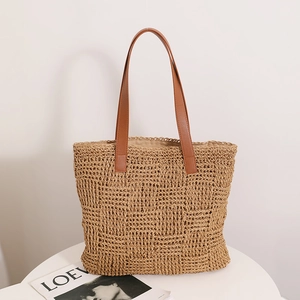 Large capacity woven straw shoulder bag with brown leather handles for beach vacation