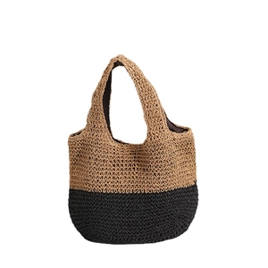 Minimalist handwoven straw tote bag with black and beige two-tone contrast design