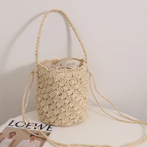 French vintage straw bucket bag with drawstring liner and woven strap for beach beachwear