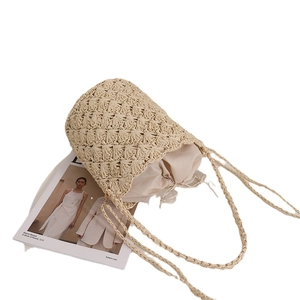 French vintage straw bucket bag with drawstring liner for seaside beach vacation