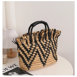 French vintage woven straw handbag with black fringe trim and round top handles