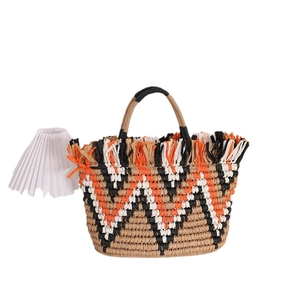 French vintage straw bag with bohemian color blocks and fringe trim for beach vacations