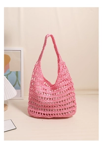 Detail of pink hand-woven hollow tote bag with intricate cotton mesh crochet design