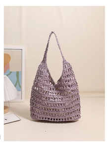 Close-up of purple woven hollow tote bag featuring a mesh texture and inner cloth lining