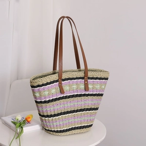 Striped woven straw tote bag with brown leather handles and colorful pastoral pattern