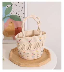 Close-up of handmade woven cotton rope basket bag with colorful beads and textured detail