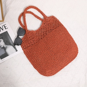 Handwoven brick red mesh tote bag with double handles for beach vacation style