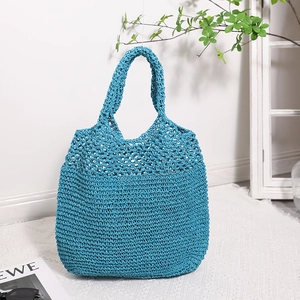 Blue hollow out straw tote bag with crochet design for summer beach holidays