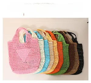Detail of woven mesh texture on hollow-out straw tote bags in various vibrant candy colors
