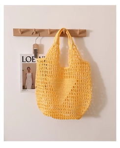 Detailed knit of yellow hollow-out straw tote bag with iconic triangle woven pattern