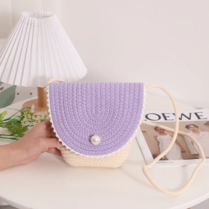 Charming woven straw crossbody bag with purple flap, faux pearl, and floral lace trim