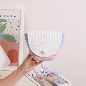 Handmade woven straw crossbody bag with tricolor patchwork and pearl buckle accent