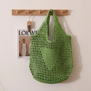 Green crochet straw tote bag with large hollow mesh and heart pattern for beach beachwear