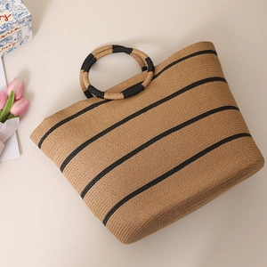 Large striped straw tote bag with round circular handles for beach summer vacation use