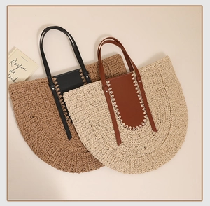 French semi-circular woven straw tote bags with leather trim and stitching detail