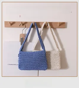 Hanging handmade cotton woven shoulder bags in blue and ivory white with soft texture