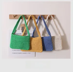 Close-up of handmade crochet cotton weave bags in multiple colors showing texture