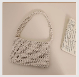 Detailed close-up of cream handmade crochet shoulder bag showing woven cotton rope texture