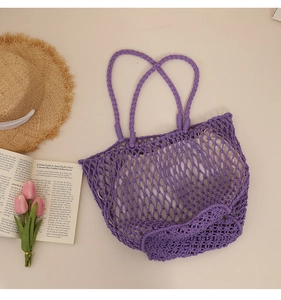 Close-up of purple woven cotton tote with white fabric lining and rustic holiday props