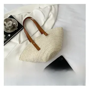 Straw tote bag size comparison with smartphone and coffee for beach vacation