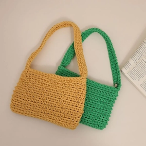 Handmade woven cotton shoulder bags in bright green and yellow with a minimalist square design