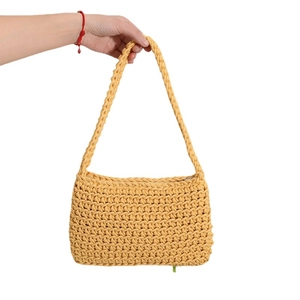 Yellow cotton woven shoulder bag with minimalist rectangular design and sturdy strap