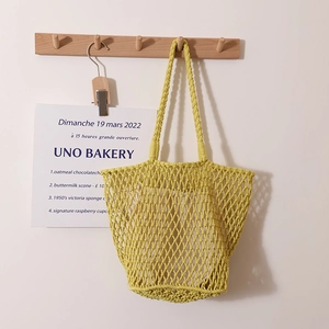 Handmade woven cotton rope tote bag with minimalist mesh design for beach and vacation