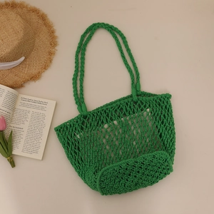 Handwoven green cotton rope tote bag with mesh design for casual beach vacation use