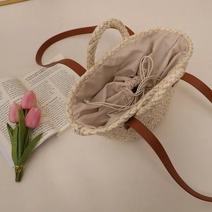 Handmade corn husk woven shoulder bag with drawstring liner and leather strap for summer