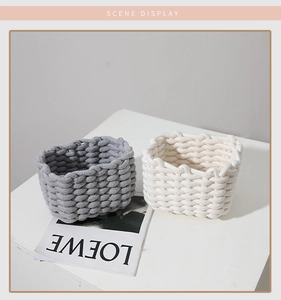 Detail of grey and beige woven cotton rope baskets for desktop organization