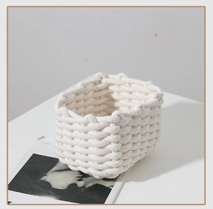 Close-up of woven cotton rope storage basket with minimalist texture and nordic style