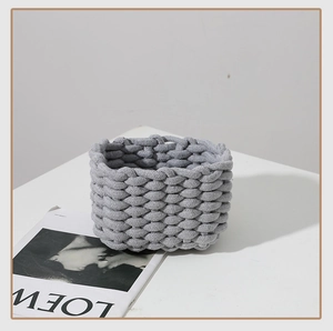 Macro shot of grey cotton rope woven storage basket showing chunky texture and details