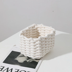 Minimalist off-white woven cotton rope storage basket for desktop organization and decor