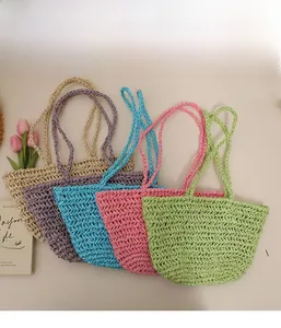 Detailed straw weave texture on casual summer beach bags in pastel candy colors