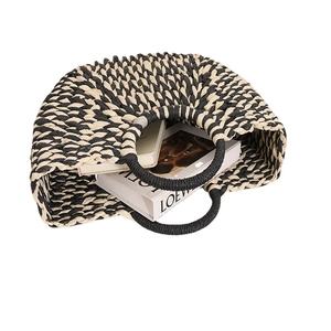 Retro semicircular woven straw handbag with black chevron pattern and round top handles