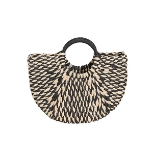 Semicircle straw woven handbag with black and beige radial stripes and round handle