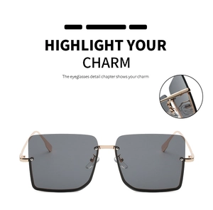 Detailed view of the durable gold metal hinges on large square vintage sunglasses