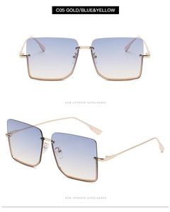 Detailed view of square gradient blue and yellow lenses with gold metal temples