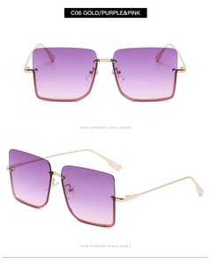 Detail of semi-rimless sunglasses with gold frames and purple-pink gradient lenses